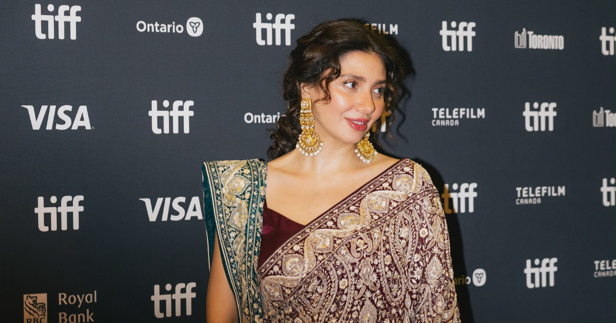 Mahira Khan smiling on the red carpet at TIFF 2026, wearing an elegant saree during her Toronto International Film Festival debut